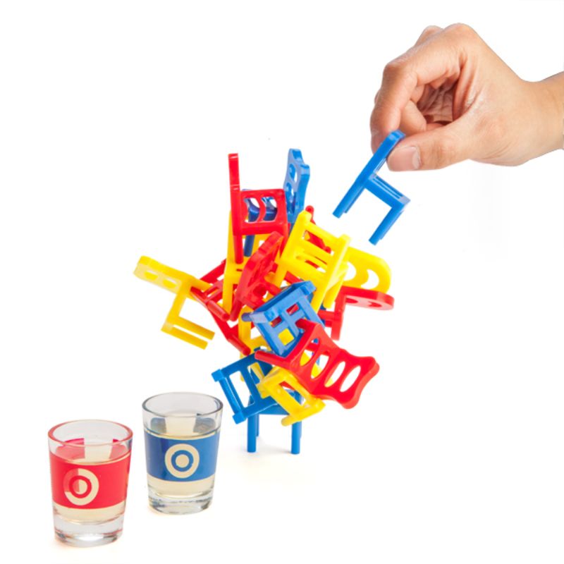 Colorful mini chairs set for a fun drinking game; includes 2 shot glasses and challenges players to balance without toppling.