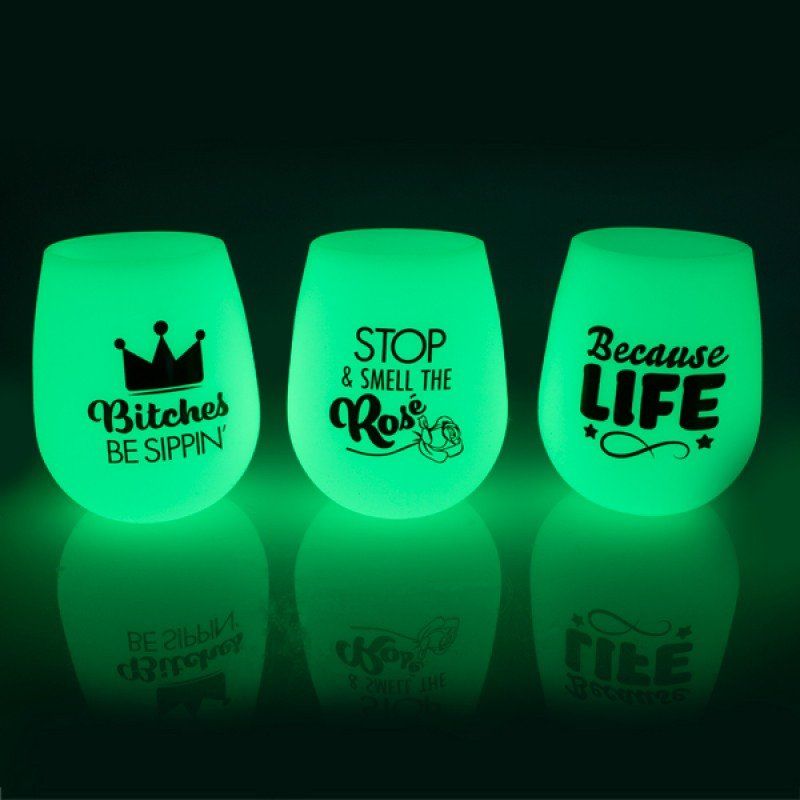 Glow-in-the-dark silicone wine cups set of 6, featuring fun sayings, shatter-proof design for parties and outdoor use.