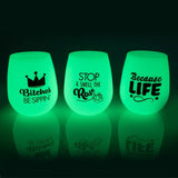 Glow-in-the-dark silicone wine cups set of 6, featuring fun sayings, shatter-proof design for parties and outdoor use.