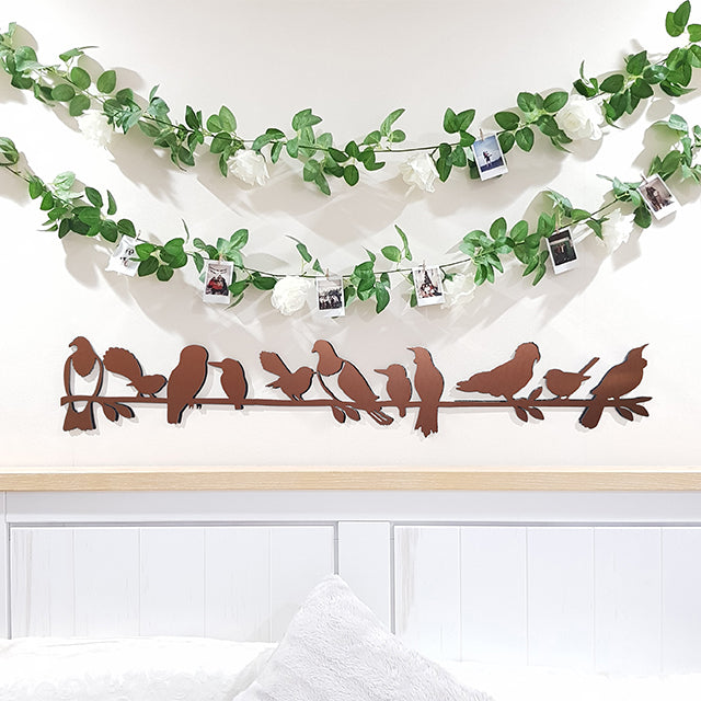 Stunning brushed copper wall art featuring NZ birds on a branch, perfect for indoor or outdoor display.