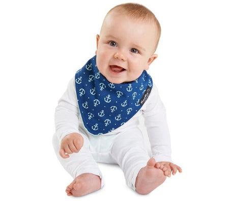Reversible navy anchor and mint bandana bib with waterproof layer, stylish for infants aged 4 months to 3 years.
