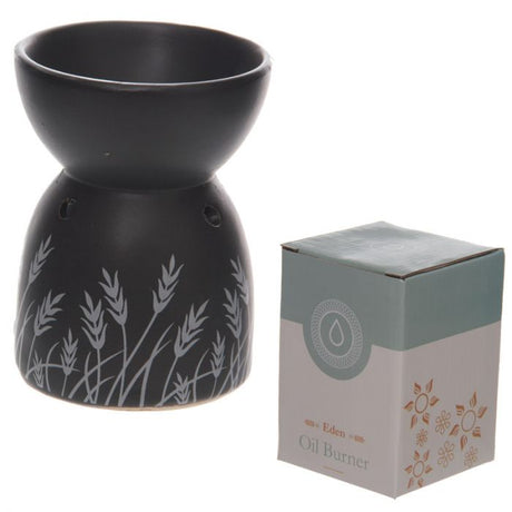 Black ceramic oil and wax burner with grass design, 12cm tall, ideal for creating a soothing aroma in any space.