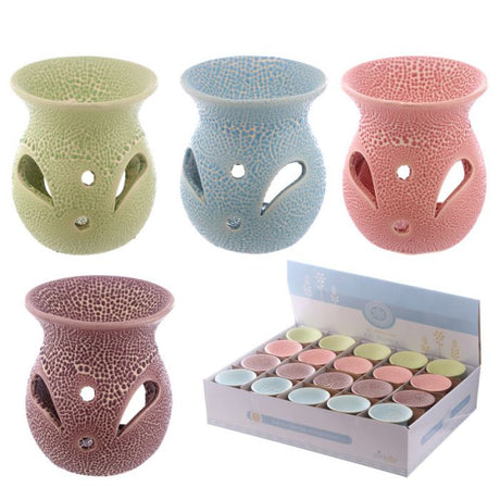 Set of 20 small textured ceramic oil burners with cut-out patterns, enhancing ambiance with soft light and aroma.