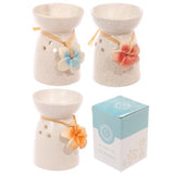 Set of 3 speckled cream ceramic oil and wax burners with floral designs, perfect for melting wax tarts and creating ambiance.