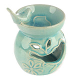 Set of 2 assorted ceramic oil burners with floral bird bath design, perfect for relaxing with essential oils, height 10.5cm.