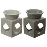 Set of 3 ceramic oil and wax burners with geometric cut-outs, perfect for enhancing ambiance with essential oils.