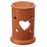 Set of 3 ceramic oil and wax burners with heart cut out design, ideal for enhancing ambiance and fragrance in any room.