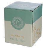 Ceramic oil and wax burners in pastel colors with cut-out lattice design, ideal for creating cozy aromas and ambiance.