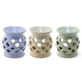 Set of 3 ceramic oil burners with scallop cut-outs, 10cm tall, ideal for enhancing ambiance with essential oils.