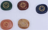 Set of 28 chakra stones in assorted colors for balancing energy and enhancing spiritual practices, packaged in a compact box.