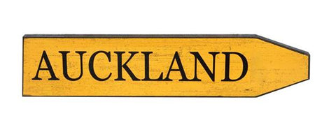 Vintage yellow street sign reading "Auckland", measuring 45x10cm, ideal for quirky home decor and gifting.