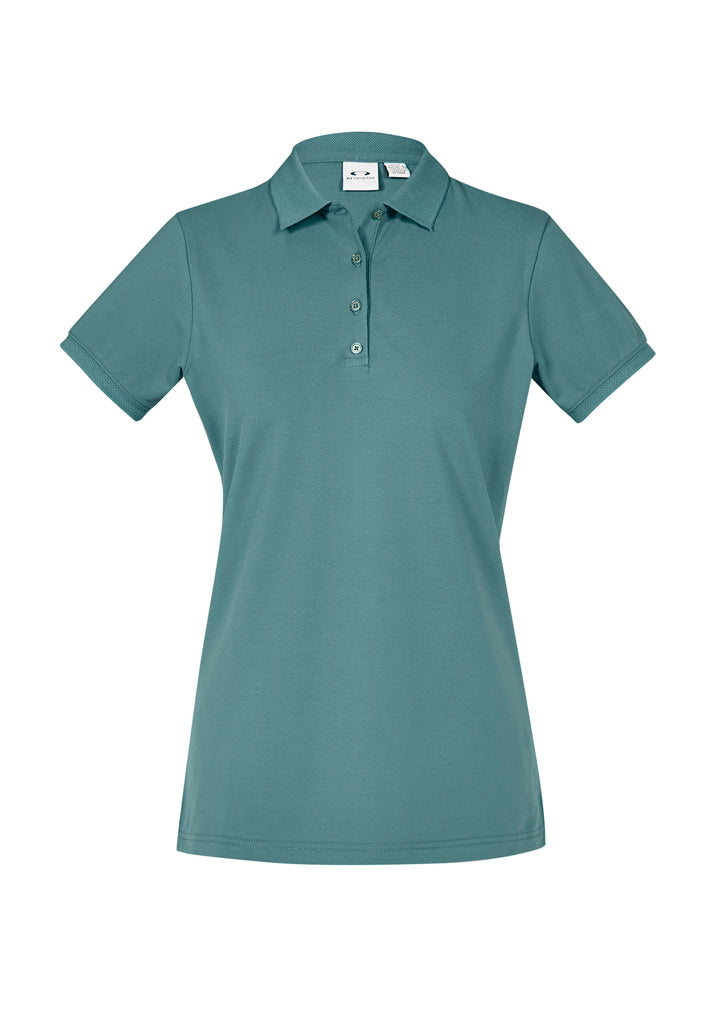 Ladies City Polo in Jasper Green, size 16, featuring breathable fabric, UPF 50+ protection, and elegant waffle knit details.