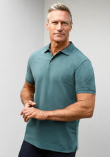 Men's City Polo in Mineral Blue (Size S) featuring a unique waffle knit collar, side splits, and UPF 50+ protection.