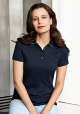 Ladies Aston Polo in Navy/Silver Grey, featuring a soft cotton fabric, elegant collar, pearlized buttons, and UPF 50+ protection.