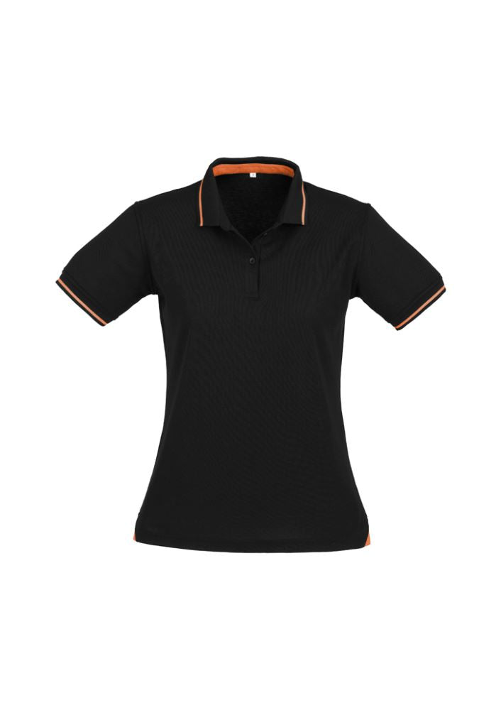 Ladies Jet Polo in Black/Orange, size 16, featuring a slim collar, contrast hem, breathable fabric, and UPF protection.