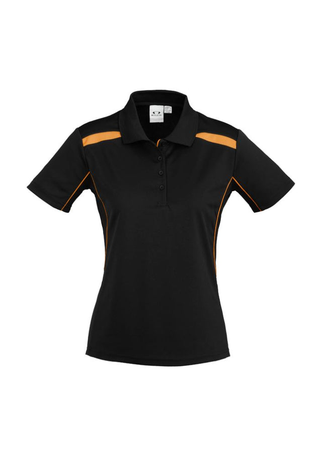 Ladies United Short Sleeve Polo in black and orange, size 10, featuring breathable fabric, stylish contrast panels, and a knitted collar.