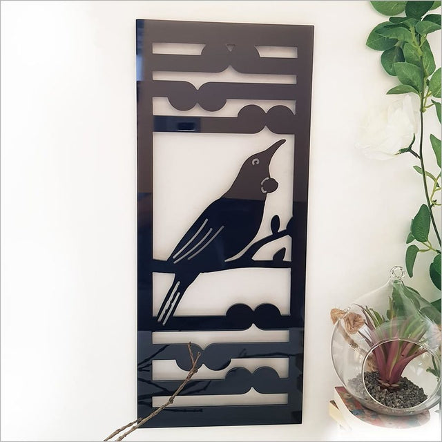 Kiwiana Wall Art featuring a Tui and Koru design in sleek black, perfect for indoor or outdoor decoration.