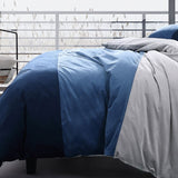 Super King Duvet Cover Set in Parker Blue featuring plush velvet panels in navy, blue, and silver for luxurious bedroom style.