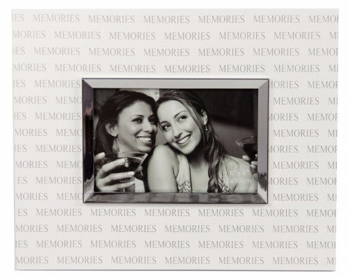Elegant white and silver 6x4 inch photo frame designed to showcase cherished memories in any decor.