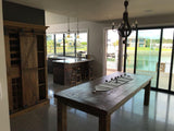 Stylish 200cm bar and wine unit with sliding doors, crafted from reclaimed pine and iron, perfect for wine enthusiasts.