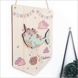 Wall art featuring a vibrant narwhal design with the message 'I Believe', crafted from eco-friendly pine veneer.