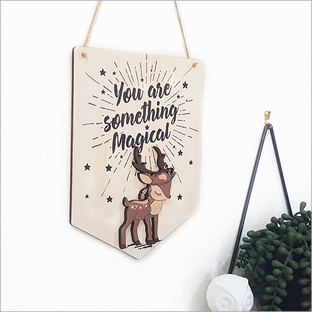 Wooden wall art featuring a whimsical printed pine flag, ready to hang, perfect for children's rooms and creative spaces.