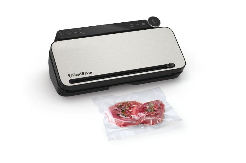 FoodSaver Controlled Multi Seal vacuum sealer by Sunbeam, featuring stainless steel design, 5 settings, and accessory hose for food preservation.