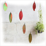 Elegant set of six printed Pohutukawa leaves on brushed silver ACM, perfect for enhancing any living space's decor.