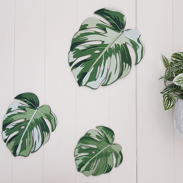 Set of 3 vibrant Monstera leaf wall hangings on ACM, perfect for indoor and outdoor decor with included hanging options.