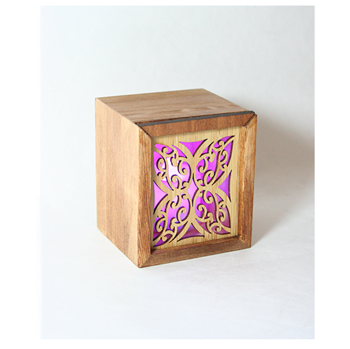 LED tealight box made of laser-cut bamboo with a color-changing tealight, also serves as a trinket box.
