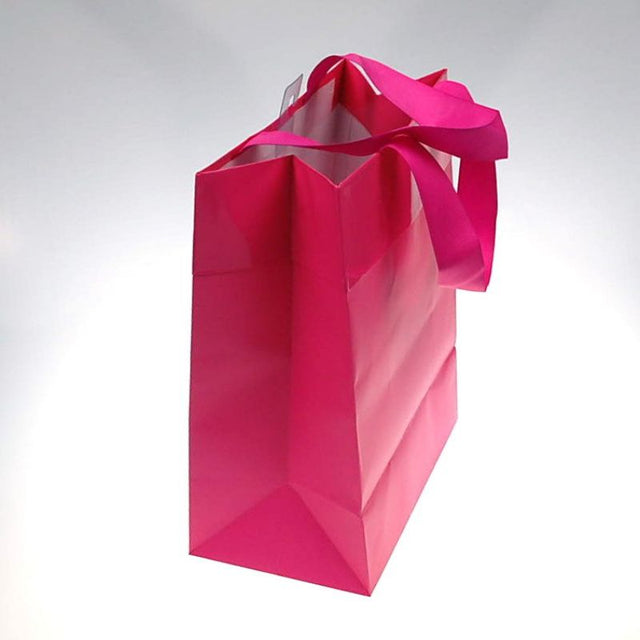 Large pink paper gift bags set of 10, 53.4cm tall, eco-friendly with handles, ideal for any celebration.