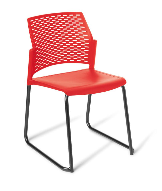 Heavy duty chair with a black frame and red seat, featuring a perforated backrest and stackable design for comfort and durability.
