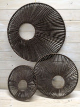Set of 3 brown round wall hangings in varying sizes for a cozy and elegant decor touch. Ideal for any interior style.