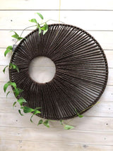 Set of 3 round wall hangings in warm brown, featuring unique designs in 30cm, 40cm, and 50cm for versatile home decor.