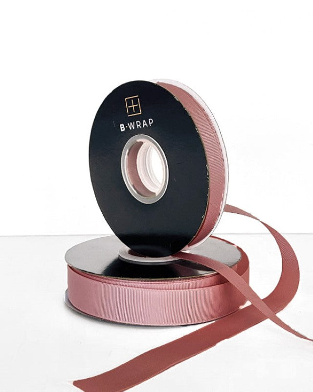 Dusty pink grosgrain ribbon, 13mm wide and 30m long, ideal for crafting, gift wrapping, and decorations.
