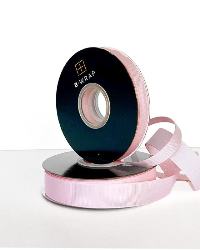 Pale pink grosgrain ribbon, 13mm x 30m, ideal for crafts, gift wrapping, and decorations with a durable, elegant finish.