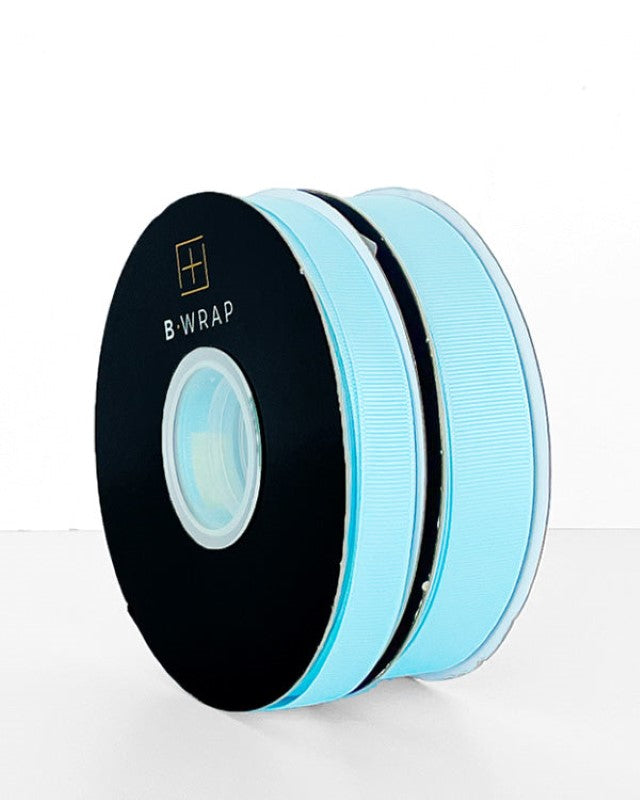 Pale blue grosgrain ribbon, 22mm wide and 30 meters long, ideal for crafting, gift wrapping, and elegant bows.