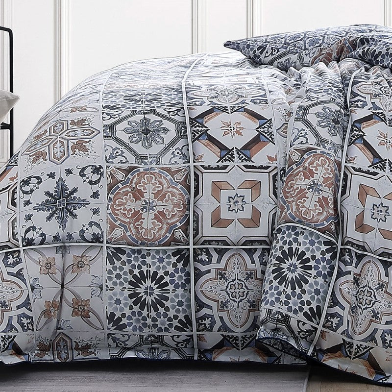 Queen duvet cover set in Restore Navy featuring oversized tile motifs, navy piping, and reversible micro tile pattern.