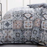 Queen duvet cover set in Restore Navy featuring oversized tile motifs, navy piping, and reversible micro tile pattern.