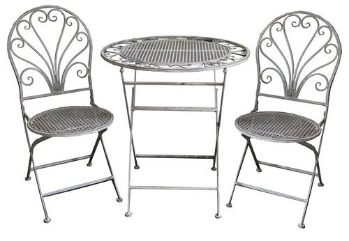 Antique grey garden chair featuring ornate detailing, perfect for stylish outdoor dining and relaxation.