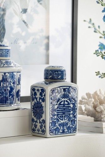 Blue and white decorative lidded jar by Rembrandt, perfect for storage or as a striking centerpiece in any room.
