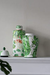 Vibrant porcelain jar with flamingo design, perfect for decor or storage, dimensions 185x185x450 mm.