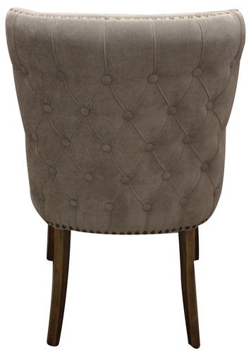 Elegant grey linen dining chair with buttoned back, solid oak frame, and foam fill for comfort and style.