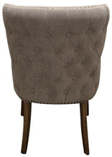 Elegant grey linen dining chair with buttoned back, solid oak frame, and foam fill for comfort and style.