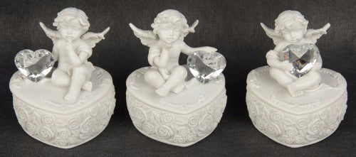 Set of 3 charming cherub figurines on heart-shaped bases, perfect for home decor and whimsical gifts.