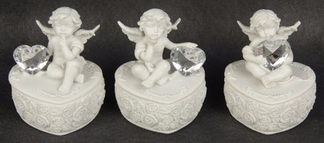 Set of 3 charming cherub figurines on heart-shaped bases, perfect for home decor and whimsical gifts.