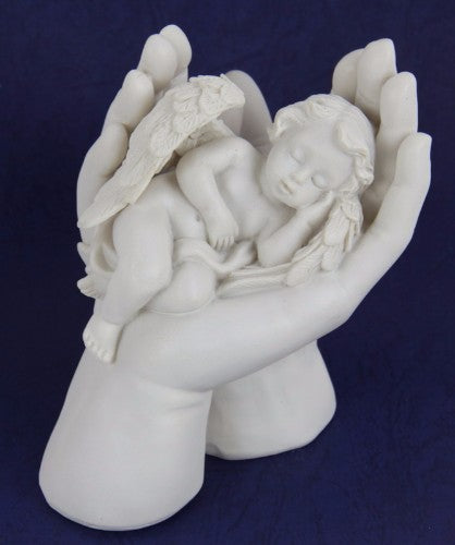 A charming handcrafted cherub figurine in hands, symbolizing love and serenity, perfect for home decor.