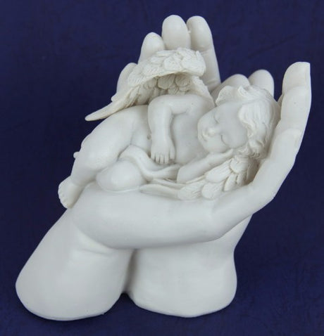 Handcrafted resin cherub ornament gently cradling a figure, embodying love and serenity for charming home decor.