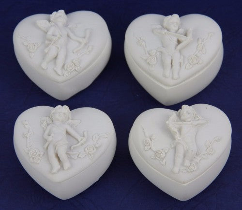 Set of 24 cherub-themed decorative ornaments, tealight holders, and oil burners in a heart-shaped box, perfect for home decor.