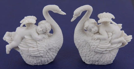 Set of 4 cherub figurines on swans, whimsical resin decor pieces for enhancing any indoor space.